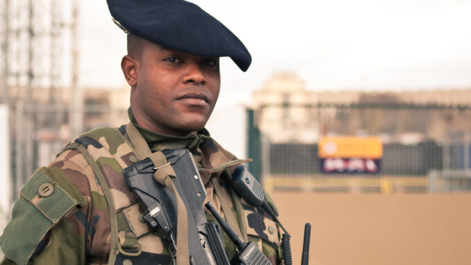 AI-enabled threats and stricter regulation in France Illustration featuring French soldier for article on cybersecurity in France.